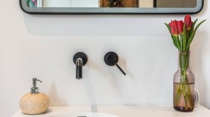 Close up image of wall hung taps