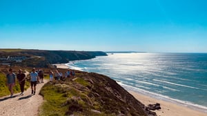 marraum team on a fundraising walk on north cornish coast