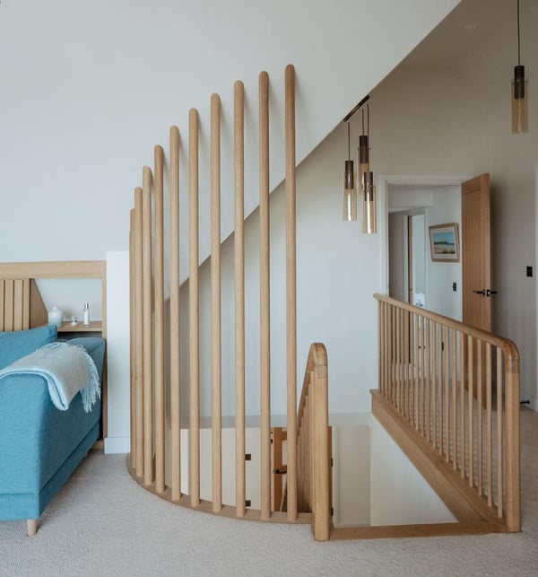 contemporary curved wooden guarding for stairwell