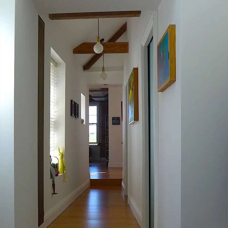 light grey hallway leading to kitchen