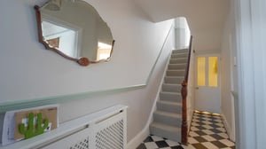 Victorian house hallway with black and white floor tiles