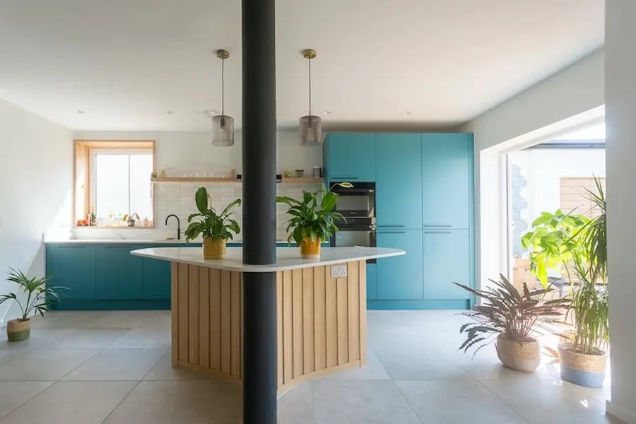 wood clad kitten island around a supporting column