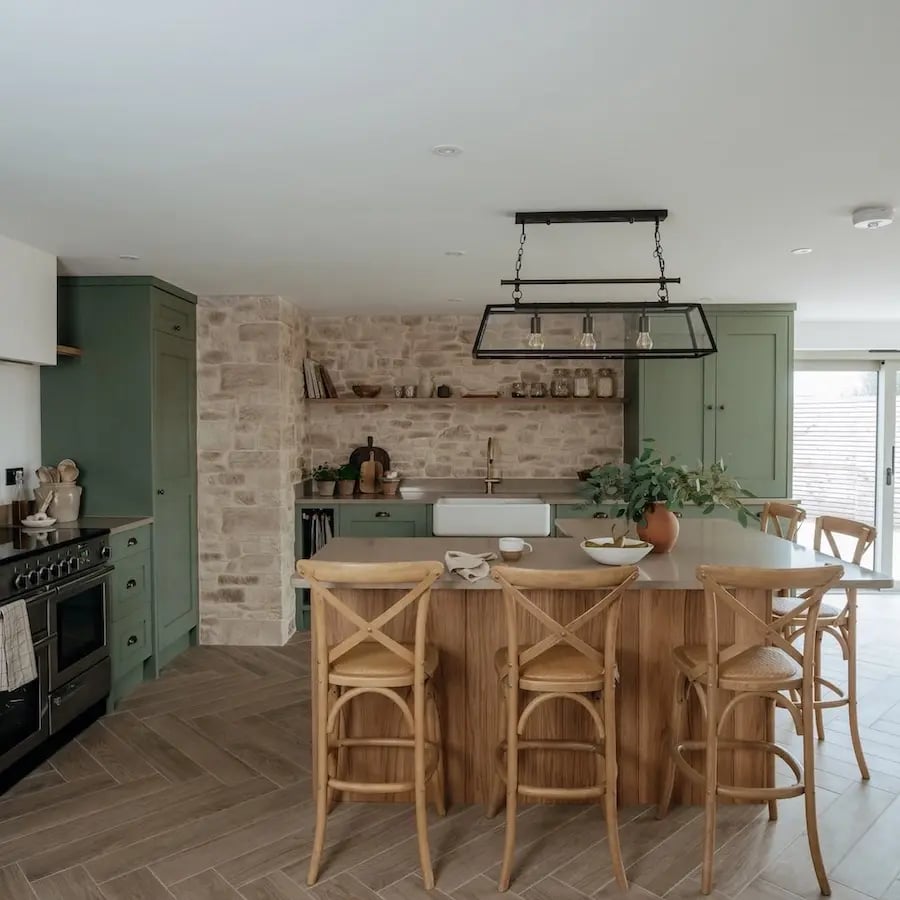 large kitchen island with wooden chairs around