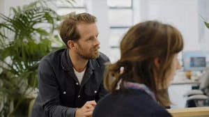 Profile of a member of the team in a meeting