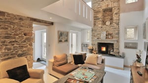 sitting room with monopoly board games set up on coffee table