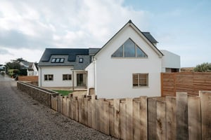 external view of gable end white rendered home