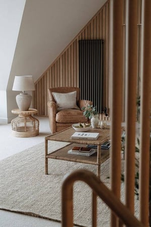view into sitting room with chair and table in the corner