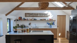 view towards kitchen over island with big oyster depot sign