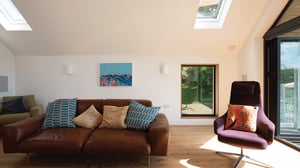 living room with comfy chairs and lots of natural light