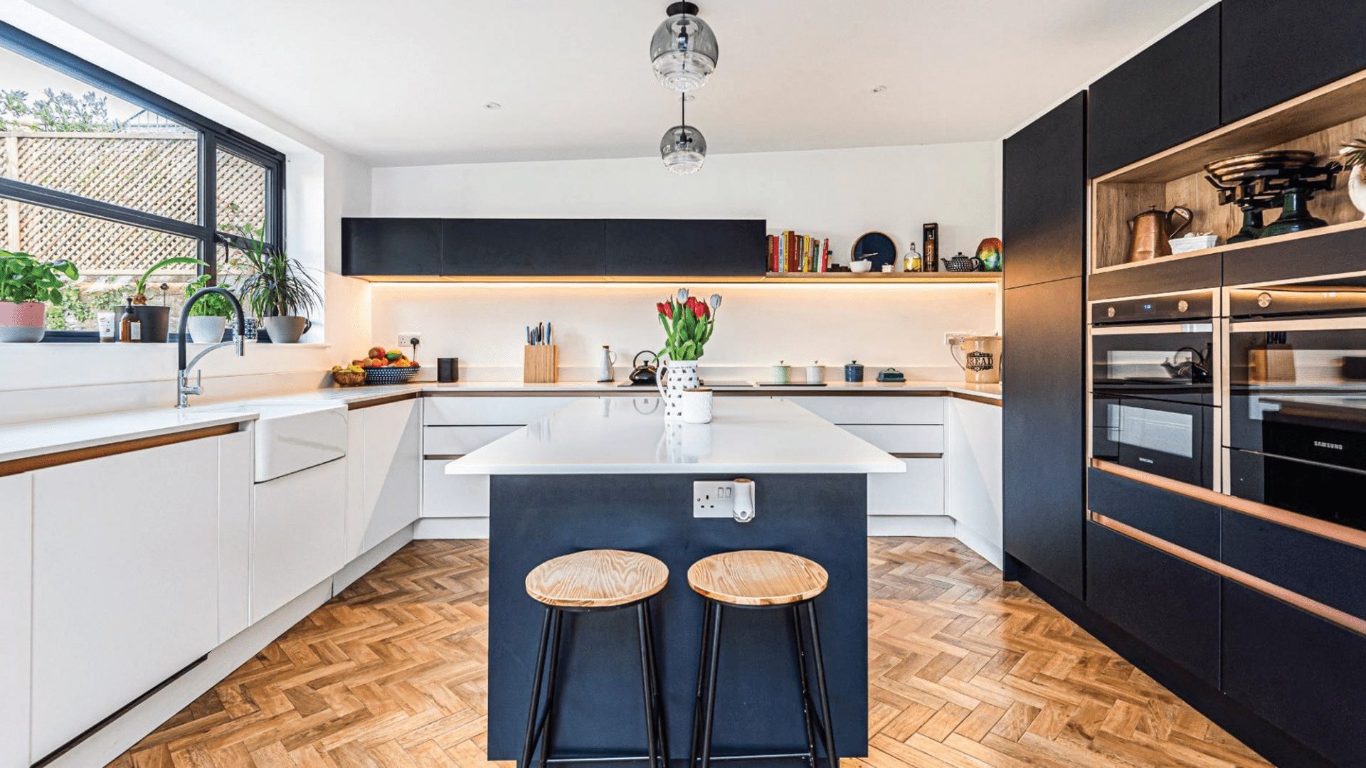 Internal view of new kitchen island with white worktops