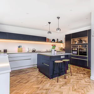 Internal view of new kitchen with white worktops