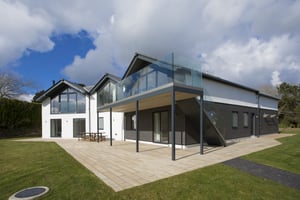 Photo of the front of a new build house completed in St Mawes, Cornwall