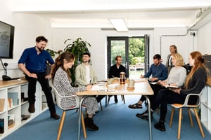 marraum team sat around a table