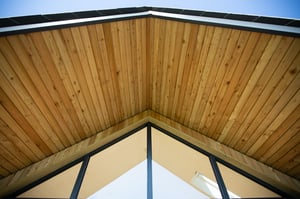 floor to ceiling windows with wooden decking cover